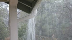 Water overflowing from a blocked eavestrough